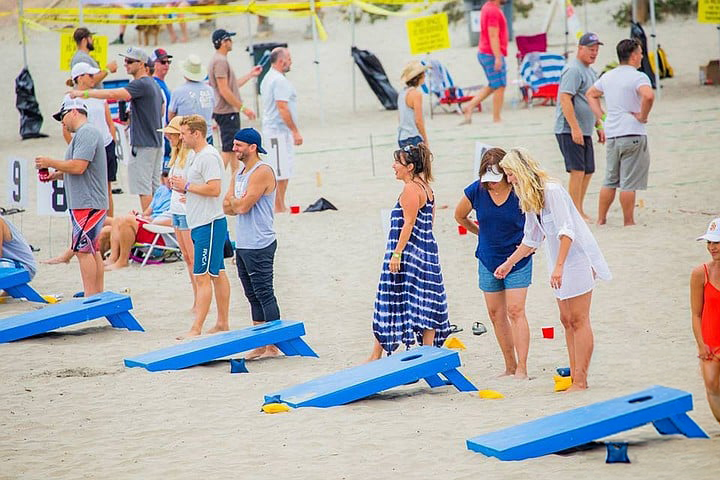 Cornhole competition on the beach at Sola Summit